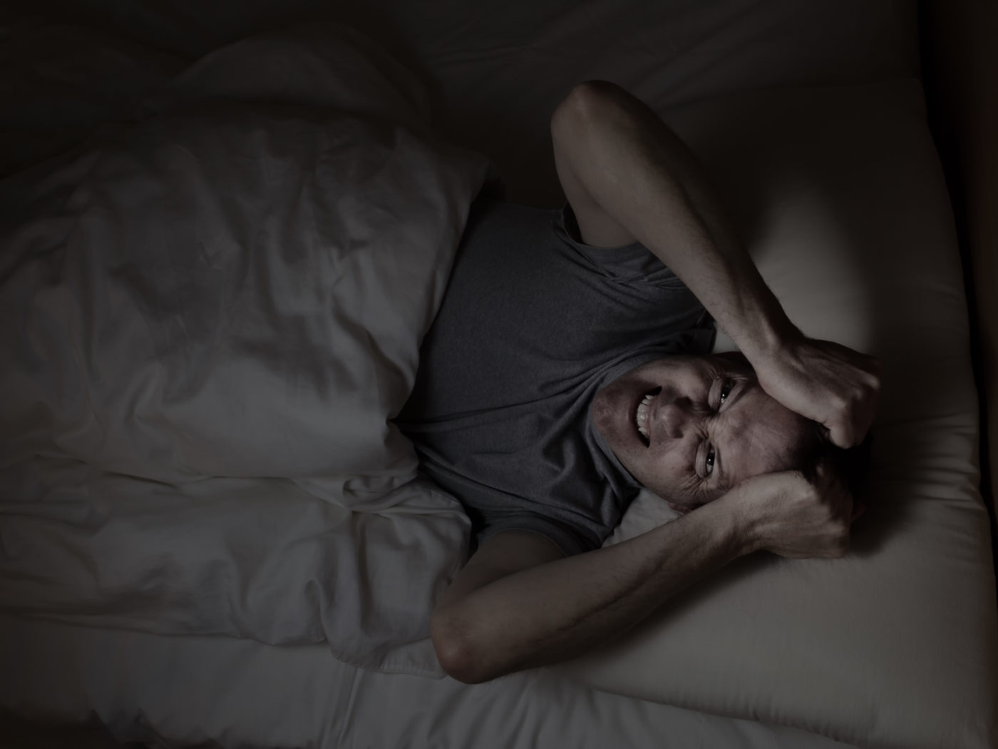 Top view image of mature man showing anger from insomnia